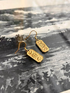 Boucles d’oreilles essentielles ◦ Carte third eye
